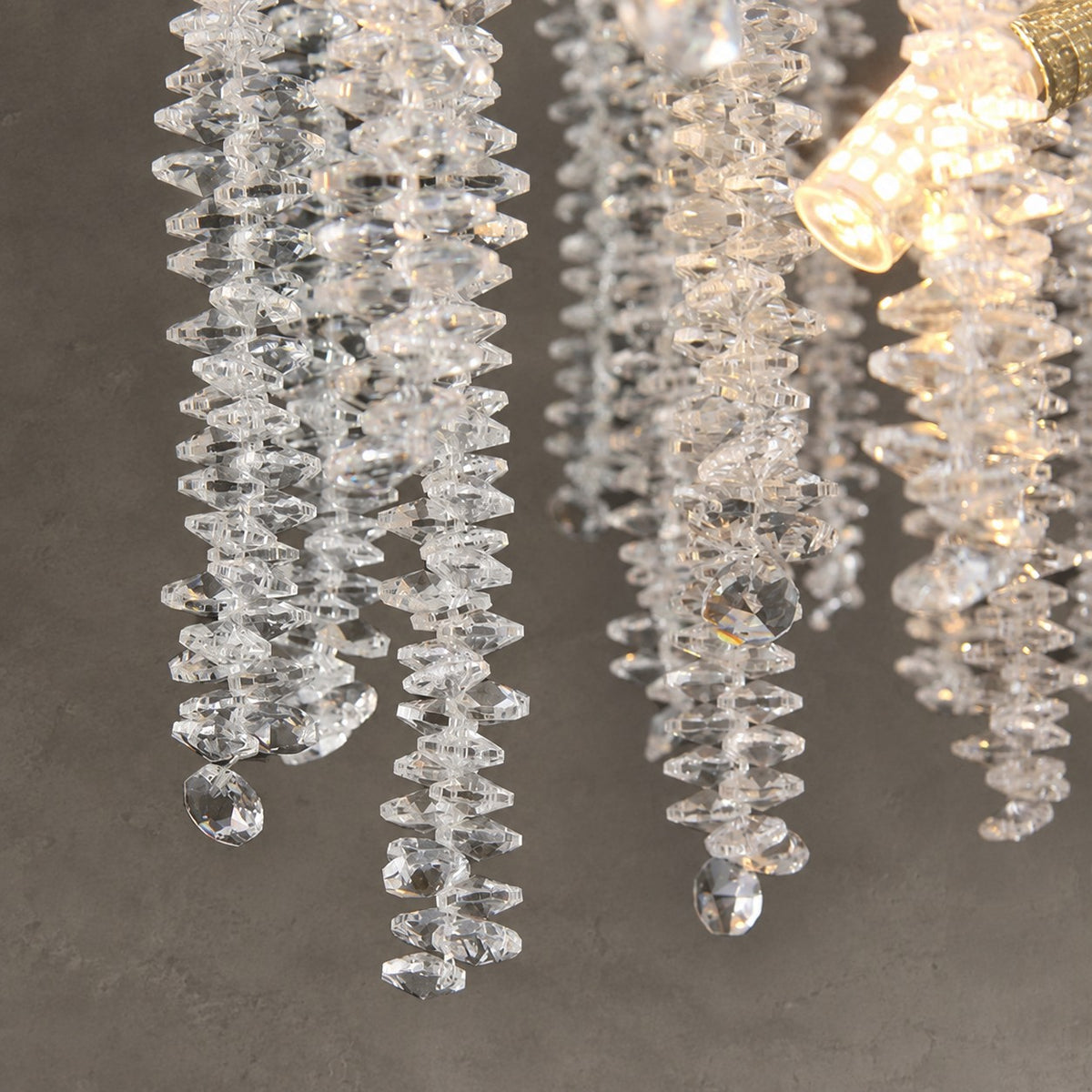 Modern Gold Coin Crystal Linear Branch Chandelier Over Dining Table