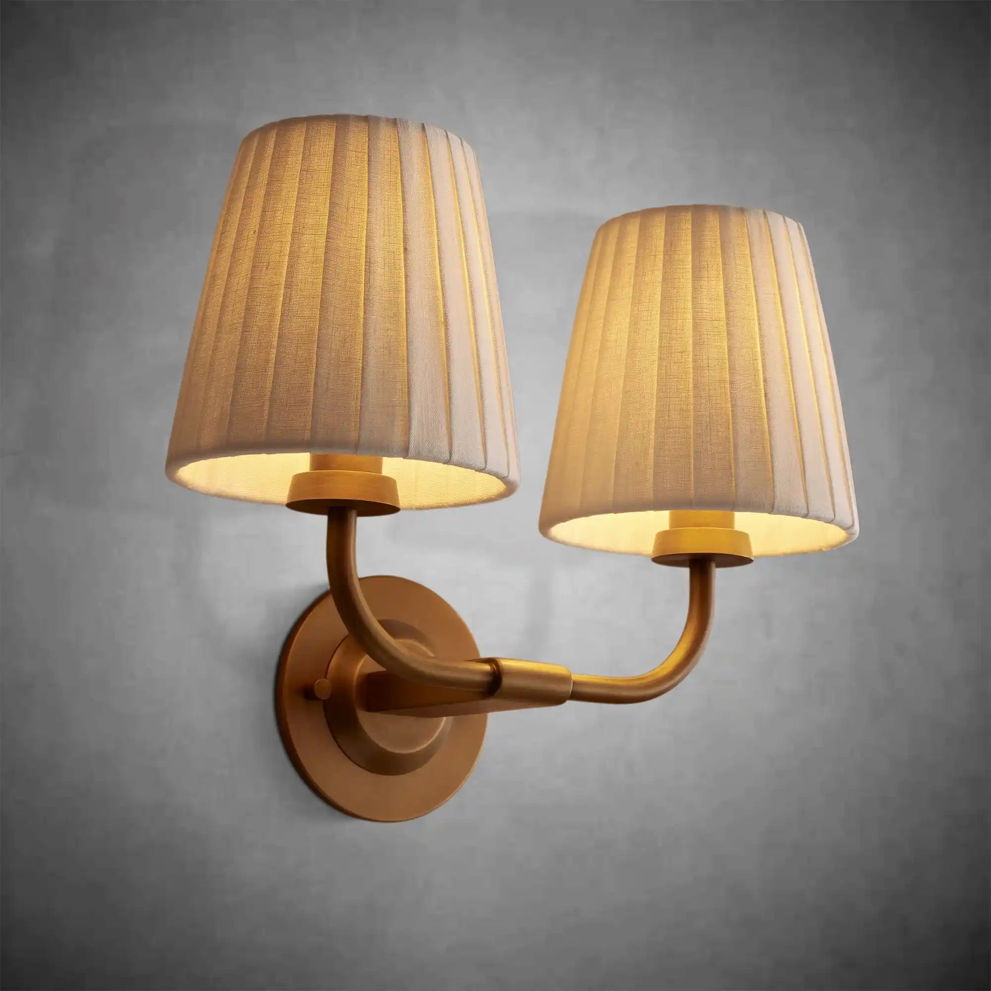 https://cdn.shopify.com/s/files/1/0736/8795/7790/files/adria-double-sconce-pleated-white-2.webp?v=1772615600