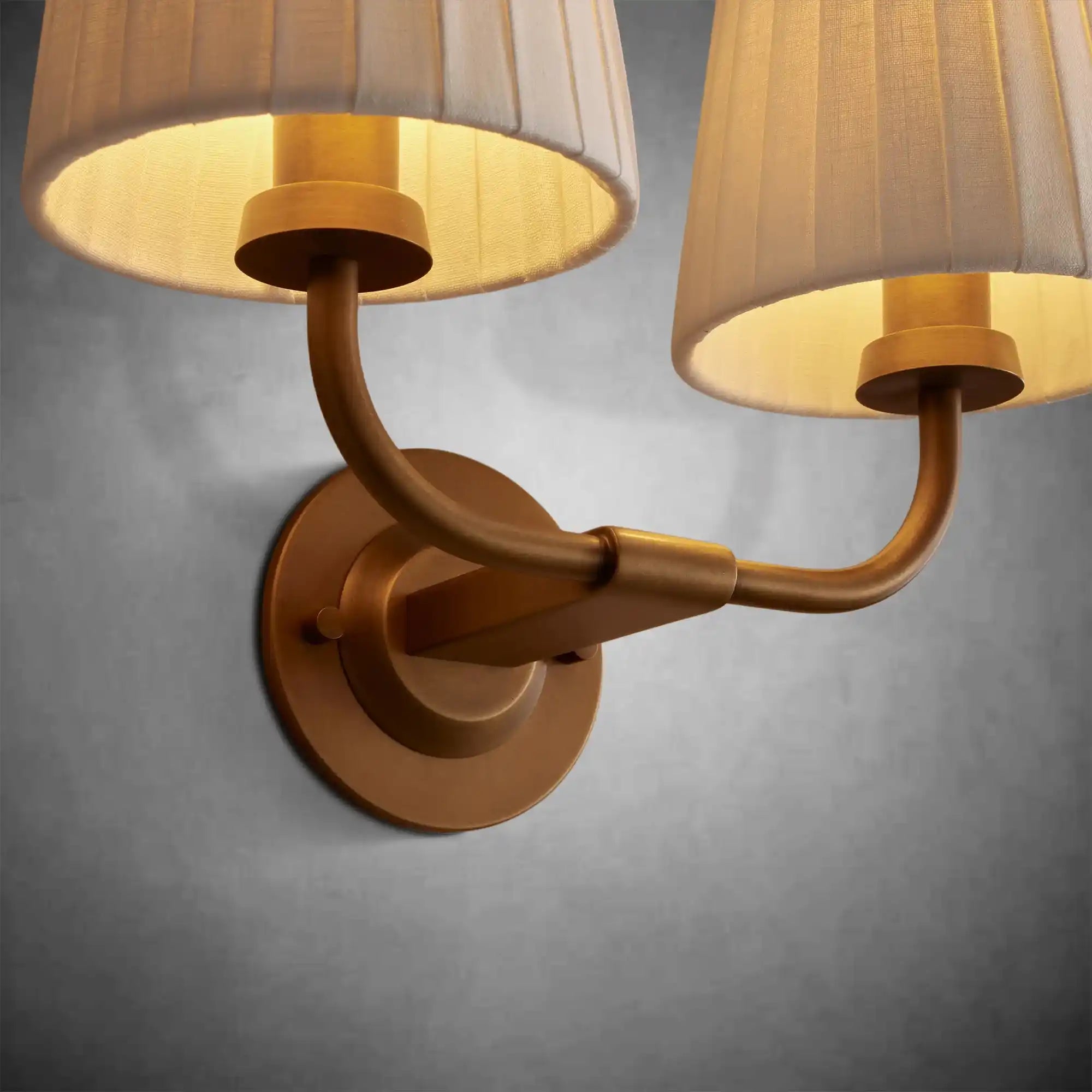 https://cdn.shopify.com/s/files/1/0736/8795/7790/files/adria-double-sconce-pleated-white-3.webp?v=1772615600