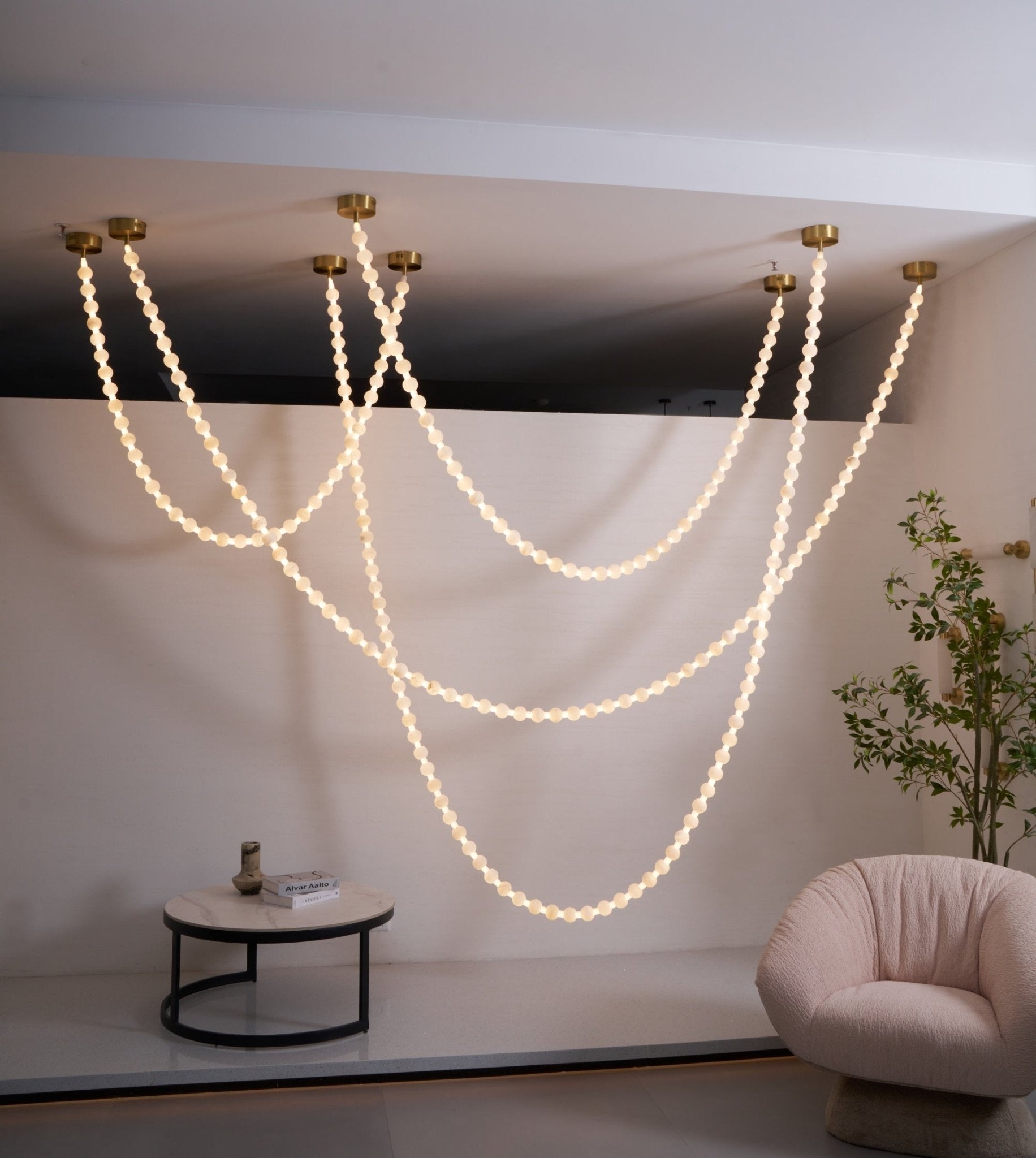 https://cdn.shopify.com/s/files/1/0736/8795/7790/files/alabaster-pearl-necklace-chandelier-1250596.jpg?v=1773801534