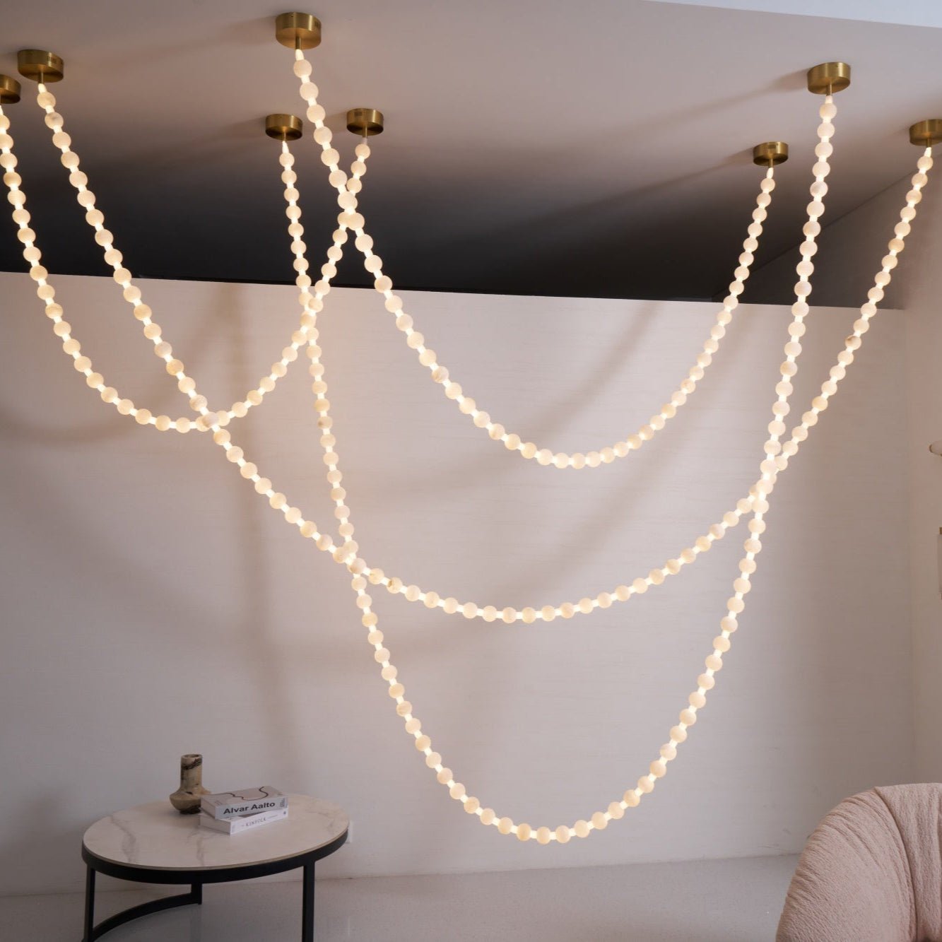 https://cdn.shopify.com/s/files/1/0736/8795/7790/files/alabaster-pearl-necklace-chandelier-3044876.jpg?v=1773801534