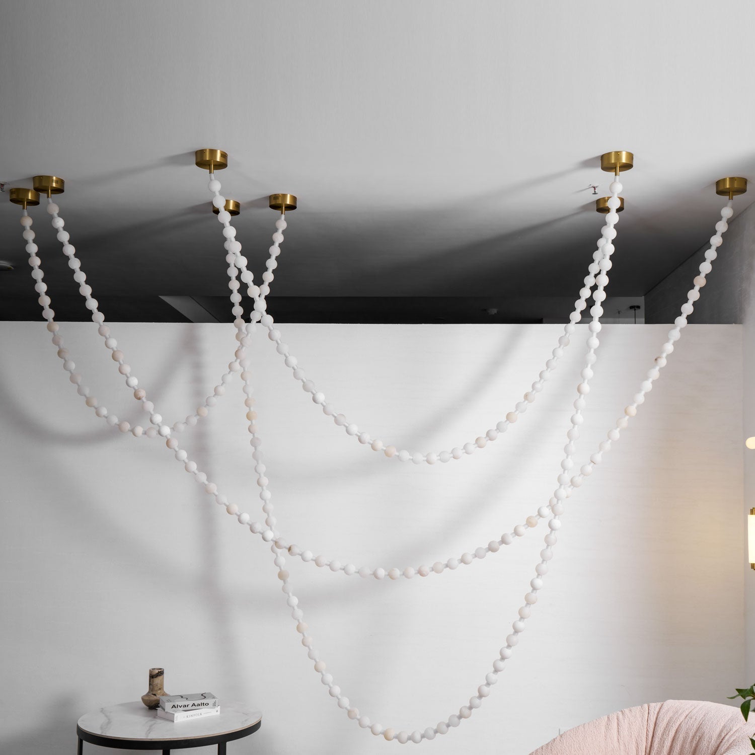 https://cdn.shopify.com/s/files/1/0736/8795/7790/files/alabaster-pearl-necklace-chandelier-4791899.jpg?v=1773801534
