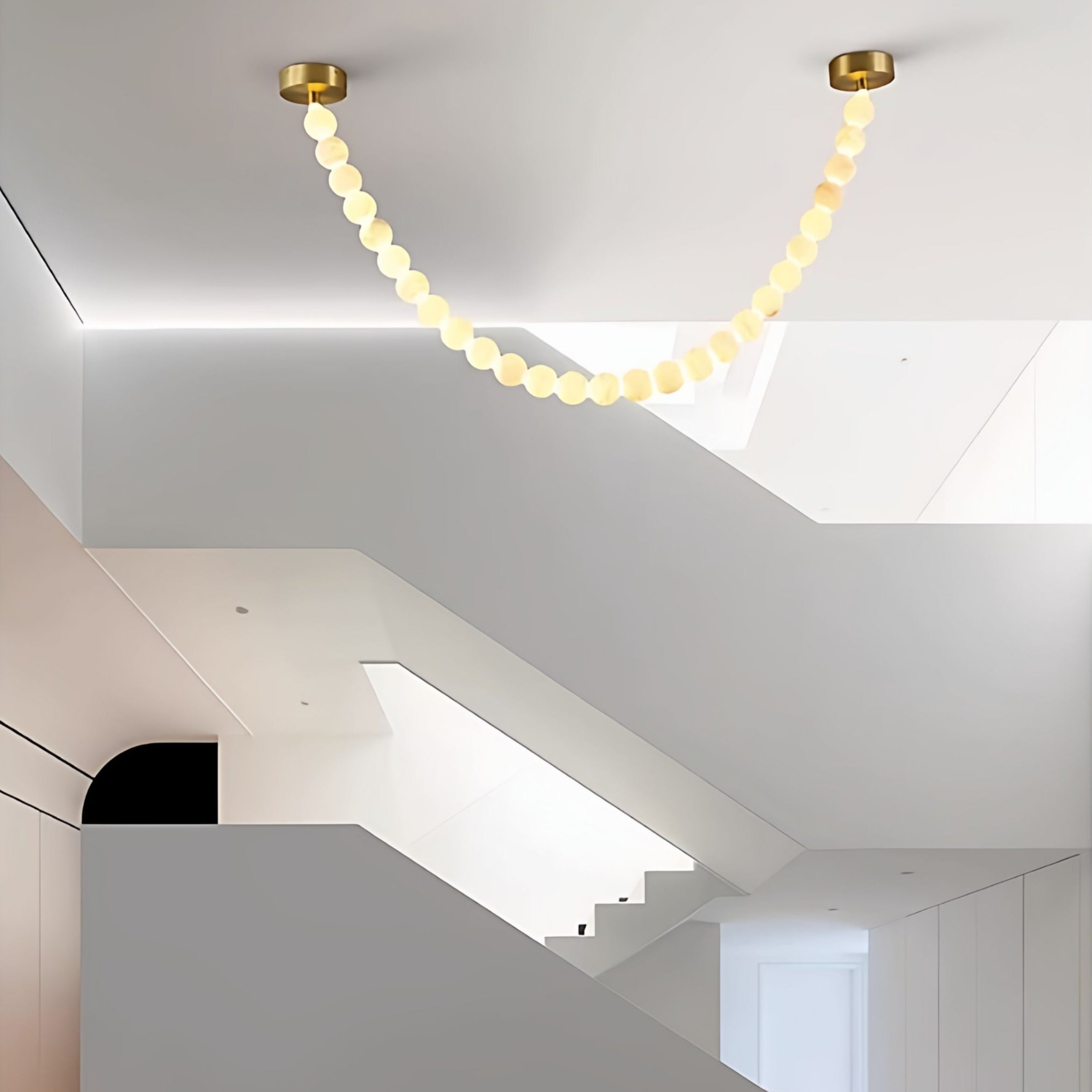 https://cdn.shopify.com/s/files/1/0736/8795/7790/files/alabaster-pearl-necklace-chandelier-5530908.jpg?v=1773801534