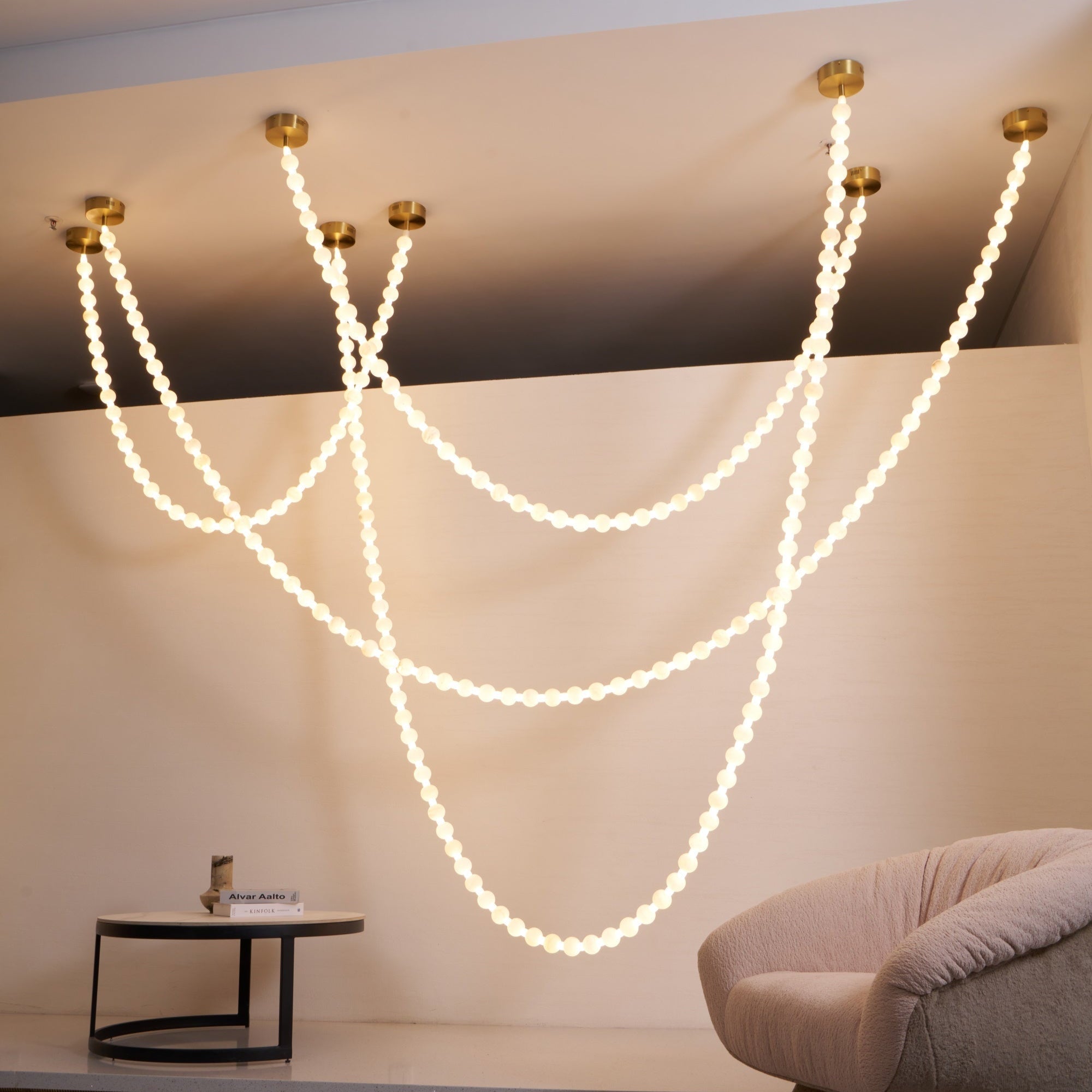 https://cdn.shopify.com/s/files/1/0736/8795/7790/files/alabaster-pearl-necklace-chandelier-8181431.jpg?v=1773801534