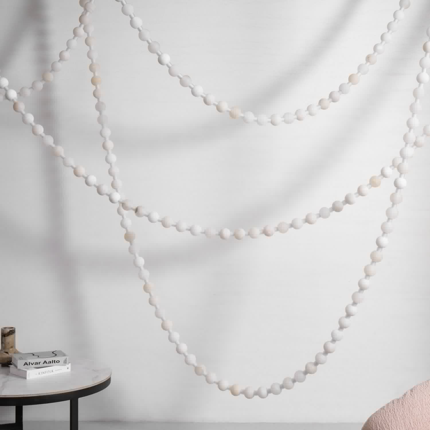 https://cdn.shopify.com/s/files/1/0736/8795/7790/files/alabaster-pearl-necklace-chandelier-8955344.jpg?v=1773801535