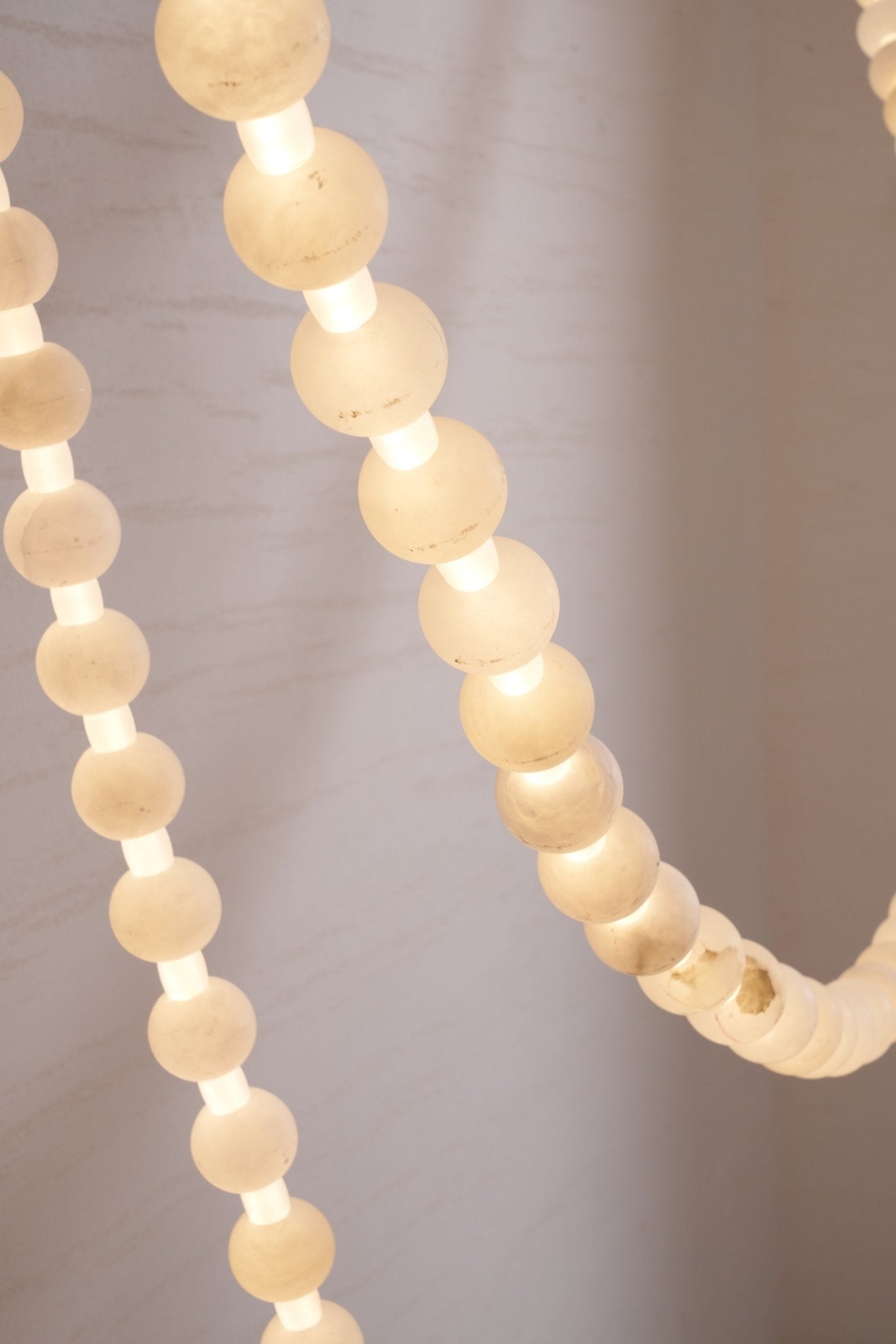https://cdn.shopify.com/s/files/1/0736/8795/7790/files/alabaster-pearl-necklace-chandelier-9646681.jpg?v=1773801533