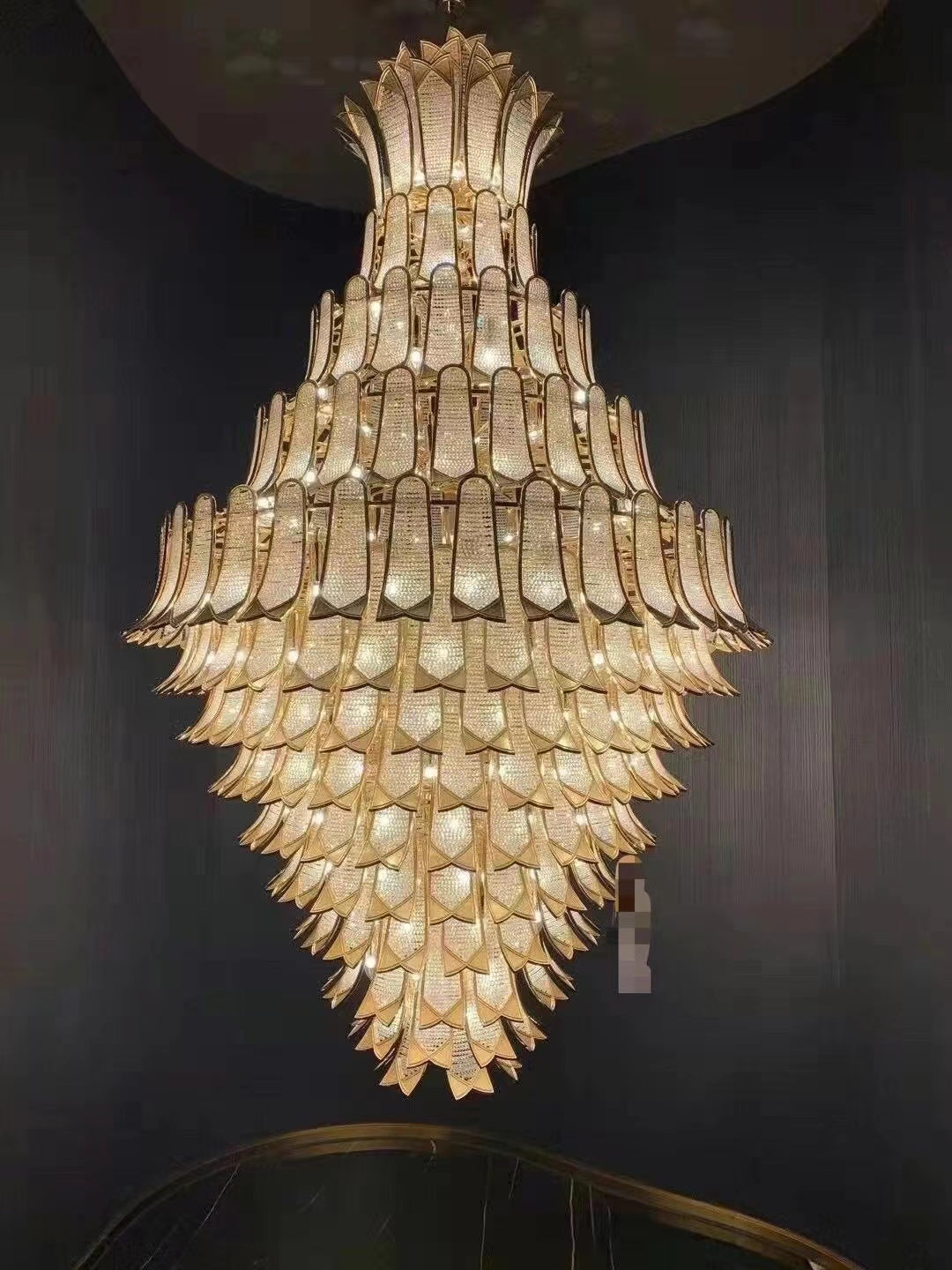 https://cdn.shopify.com/s/files/1/0736/8795/7790/files/extra-large-luxury-multi-tier-gold-crystalchandelier-for-stairslarge-high-ceiling-room-merlin-lamps-8.jpg?v=1765406244