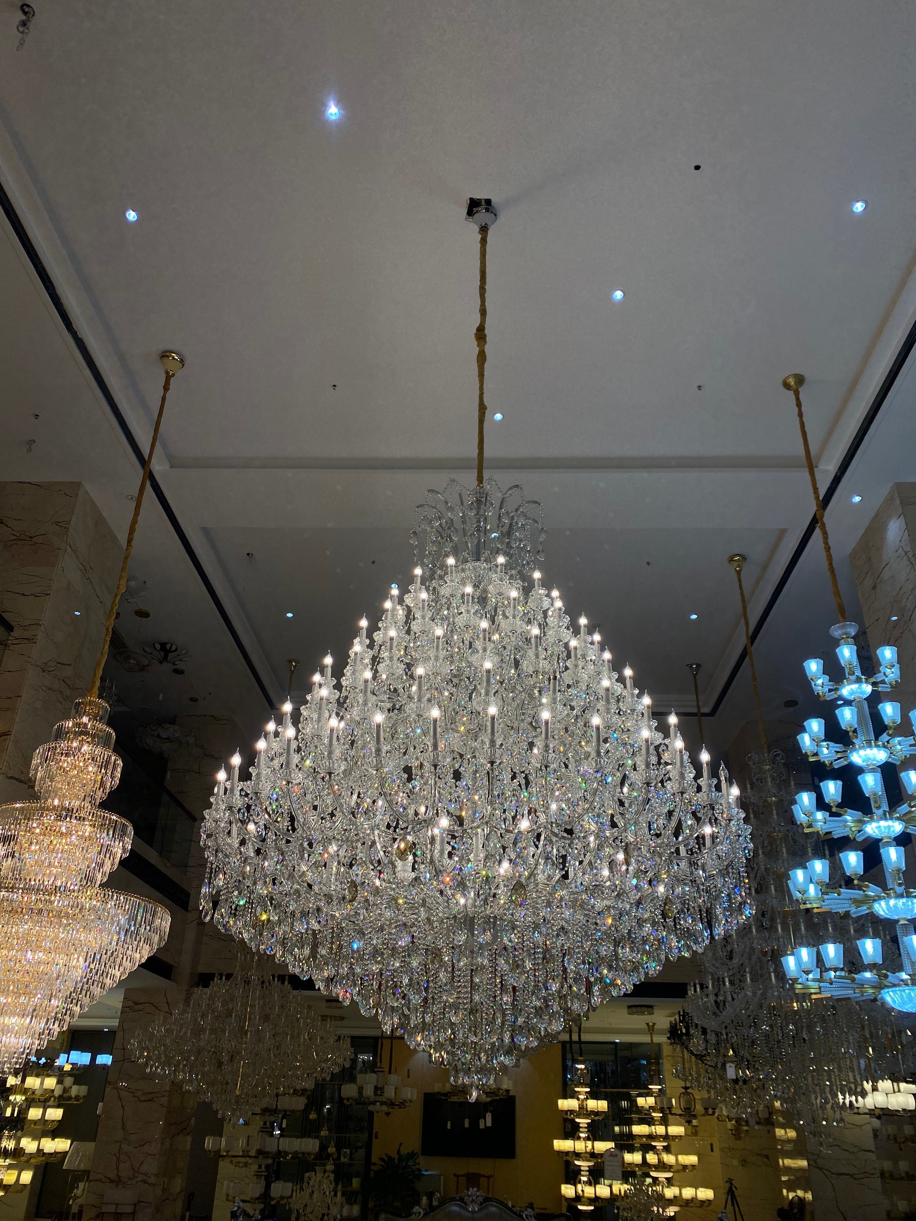 https://cdn.shopify.com/s/files/1/0778/2046/1351/files/extra-large-multi-tiered-candle-light-crystal-chandelier-for-hotelrestaurant-merlin-lamps-11.jpg?v=1765781478