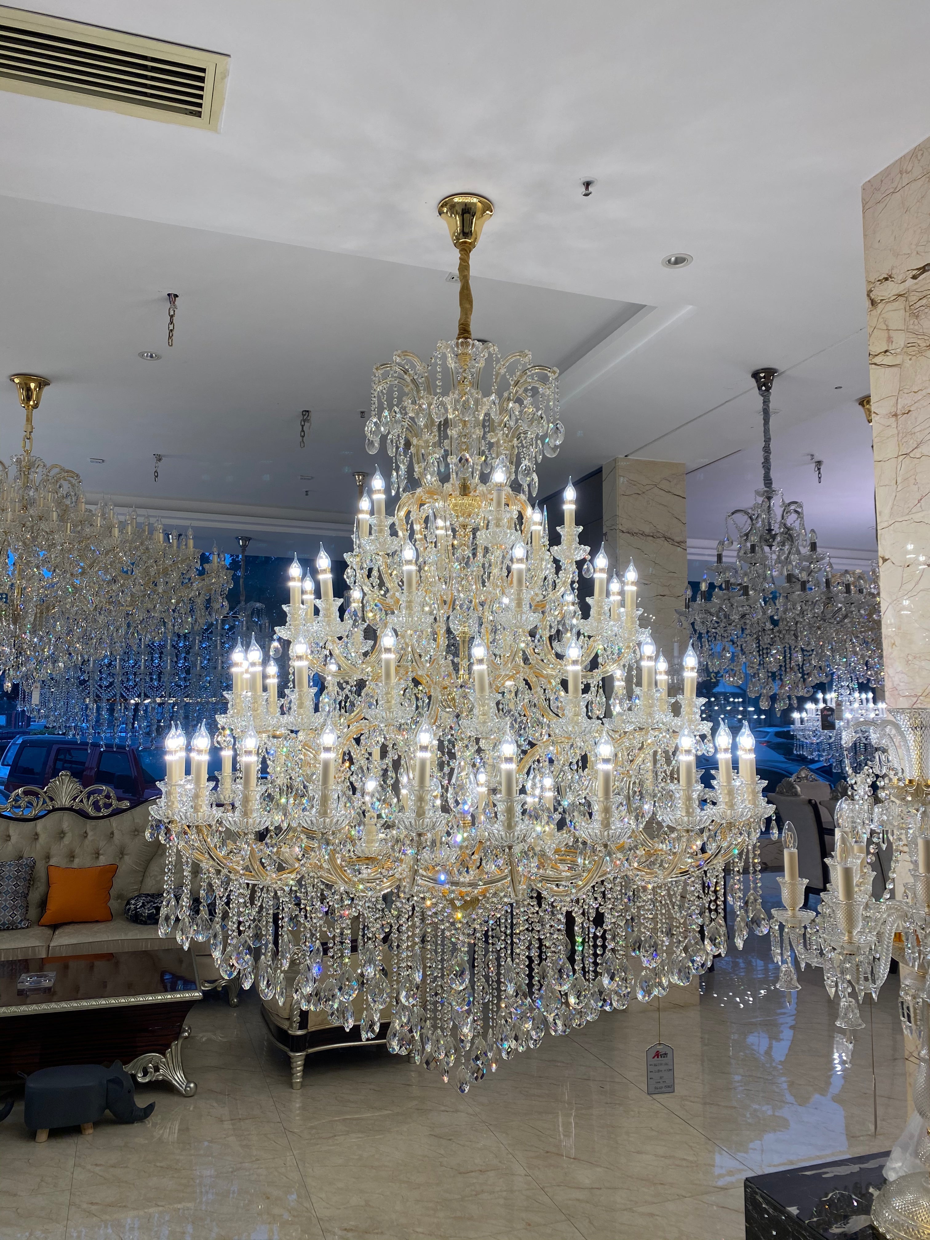 https://cdn.shopify.com/s/files/1/0778/2046/1351/files/extra-large-multi-tiered-candle-light-crystal-chandelier-for-hotelrestaurant-merlin-lamps-4.jpg?v=1765781479