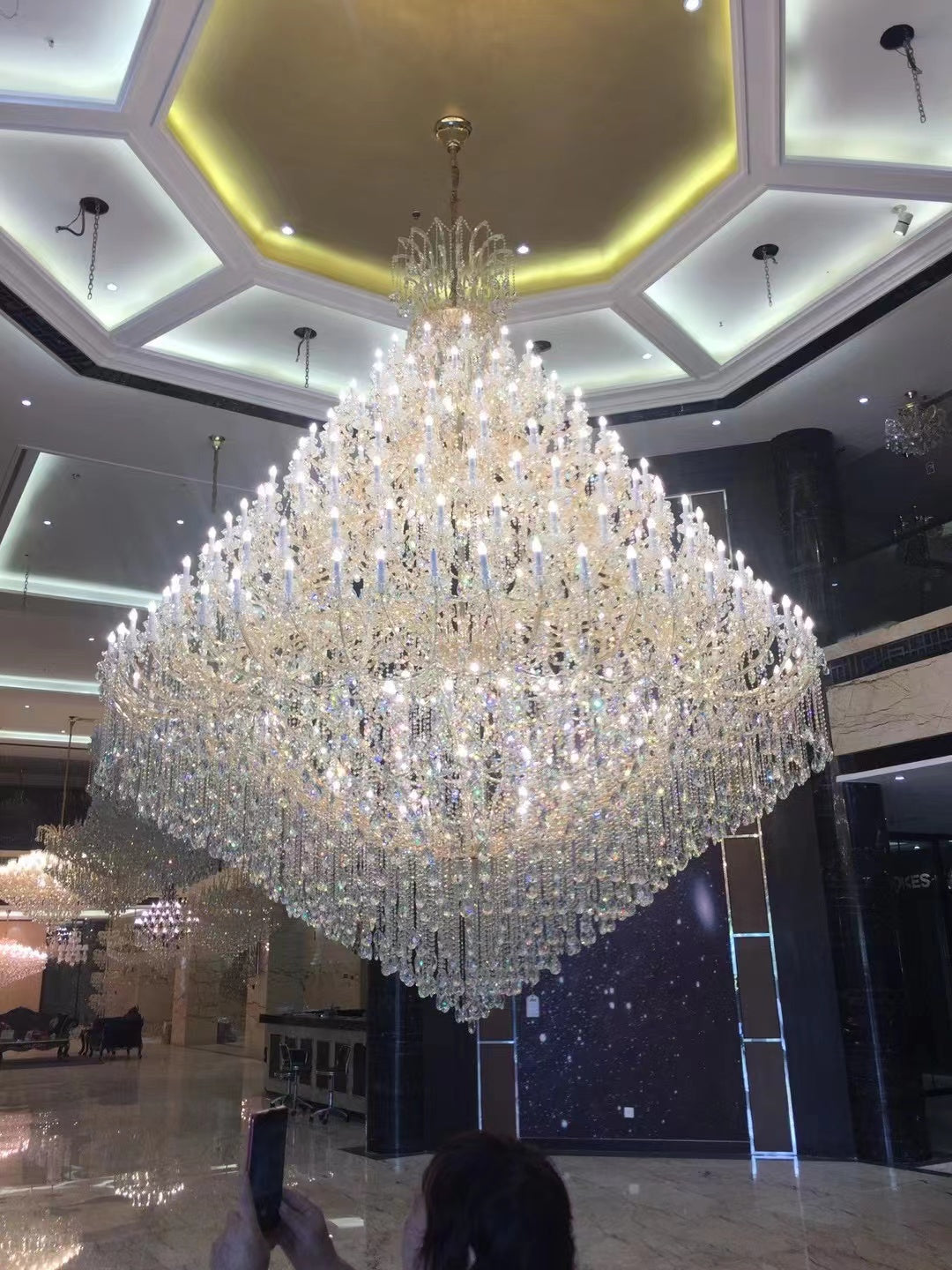 https://cdn.shopify.com/s/files/1/0778/2046/1351/files/extra-large-multi-tiered-candle-light-crystal-chandelier-for-hotelrestaurant-merlin-lamps-7.jpg?v=1765781477