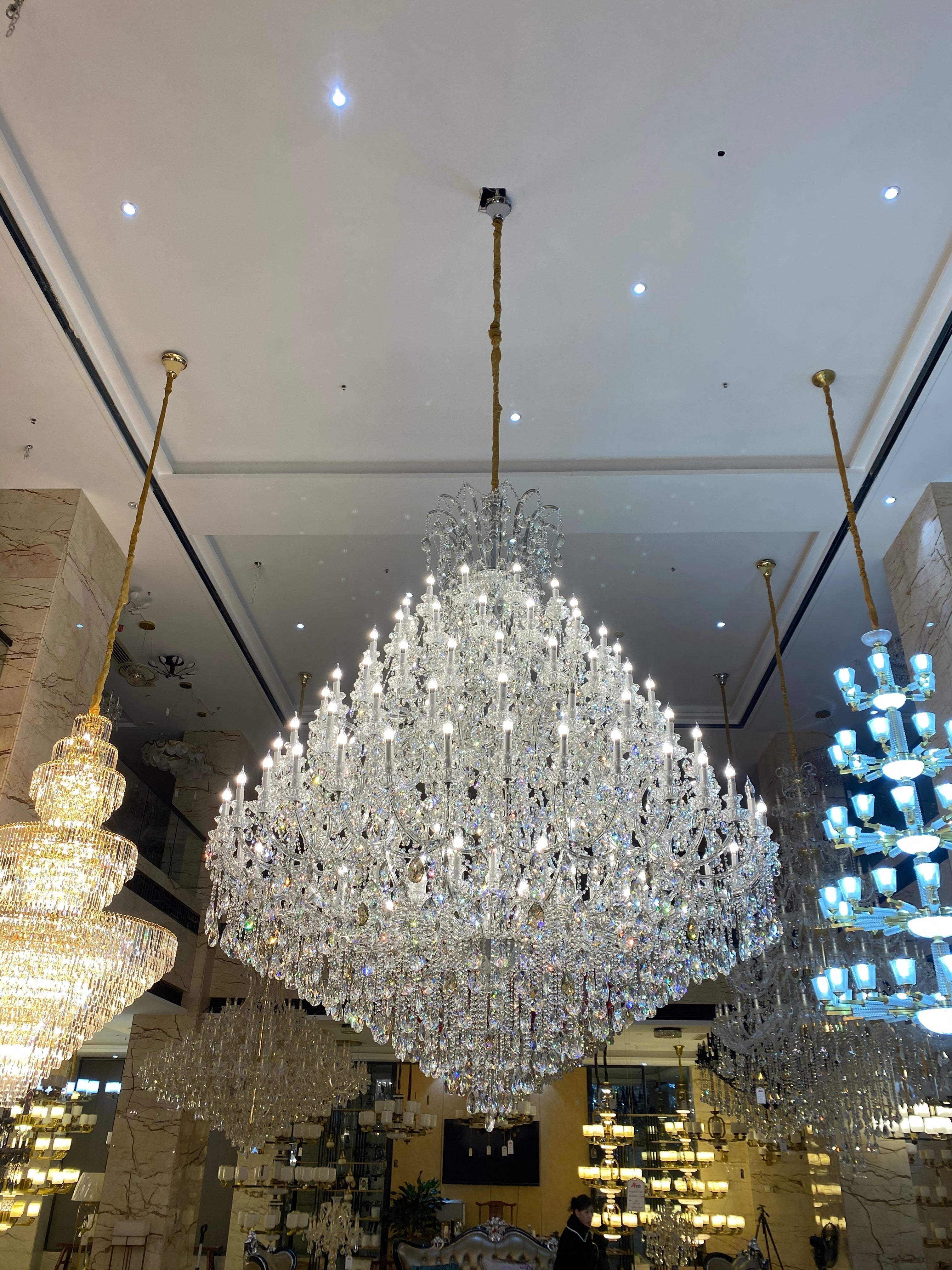 https://cdn.shopify.com/s/files/1/0778/2046/1351/files/extra-large-multi-tiered-candle-light-crystal-chandelier-for-hotelrestaurant-merlin-lamps-8.jpg?v=1765781478