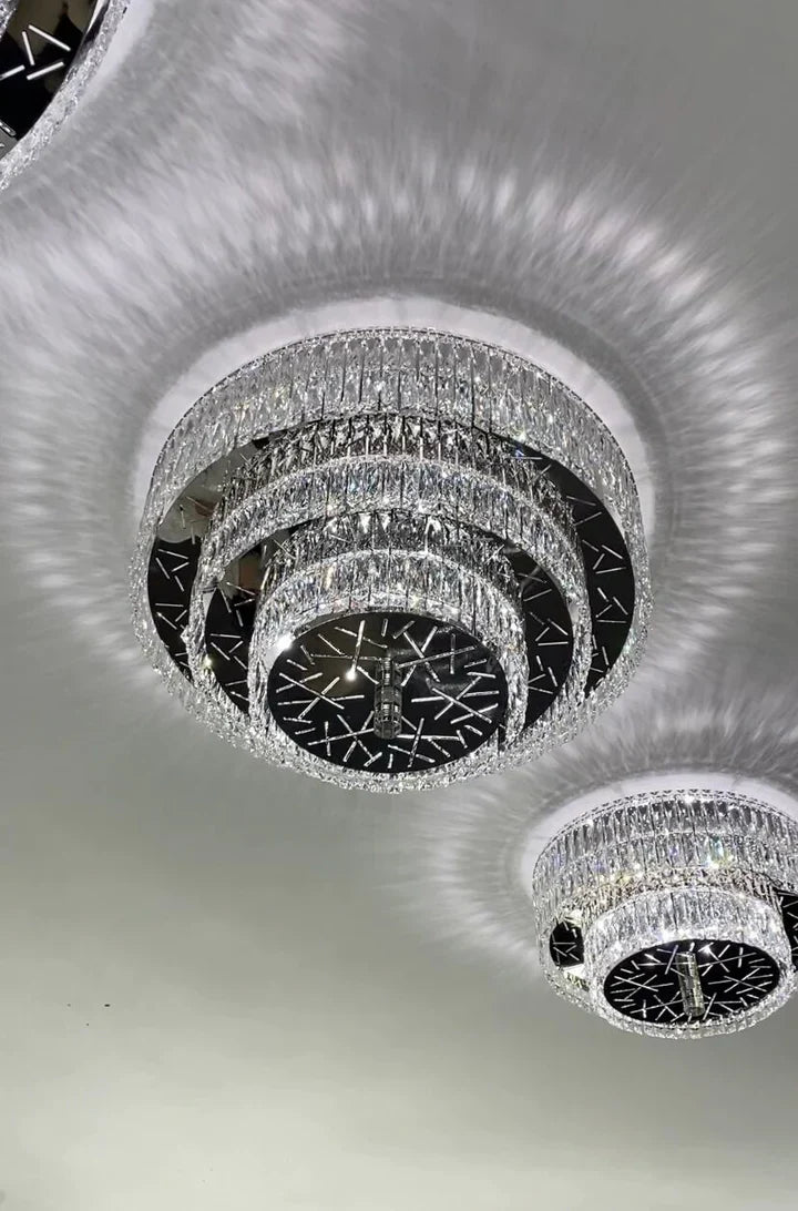 https://cdn.shopify.com/s/files/1/0736/8795/7790/files/oversized-modern-creative-flush-mount-round-multi-layers-crystal-pendant-chandelier-for-livingdining-roomhallway-merlin-lamps-4.webp?v=1765402419