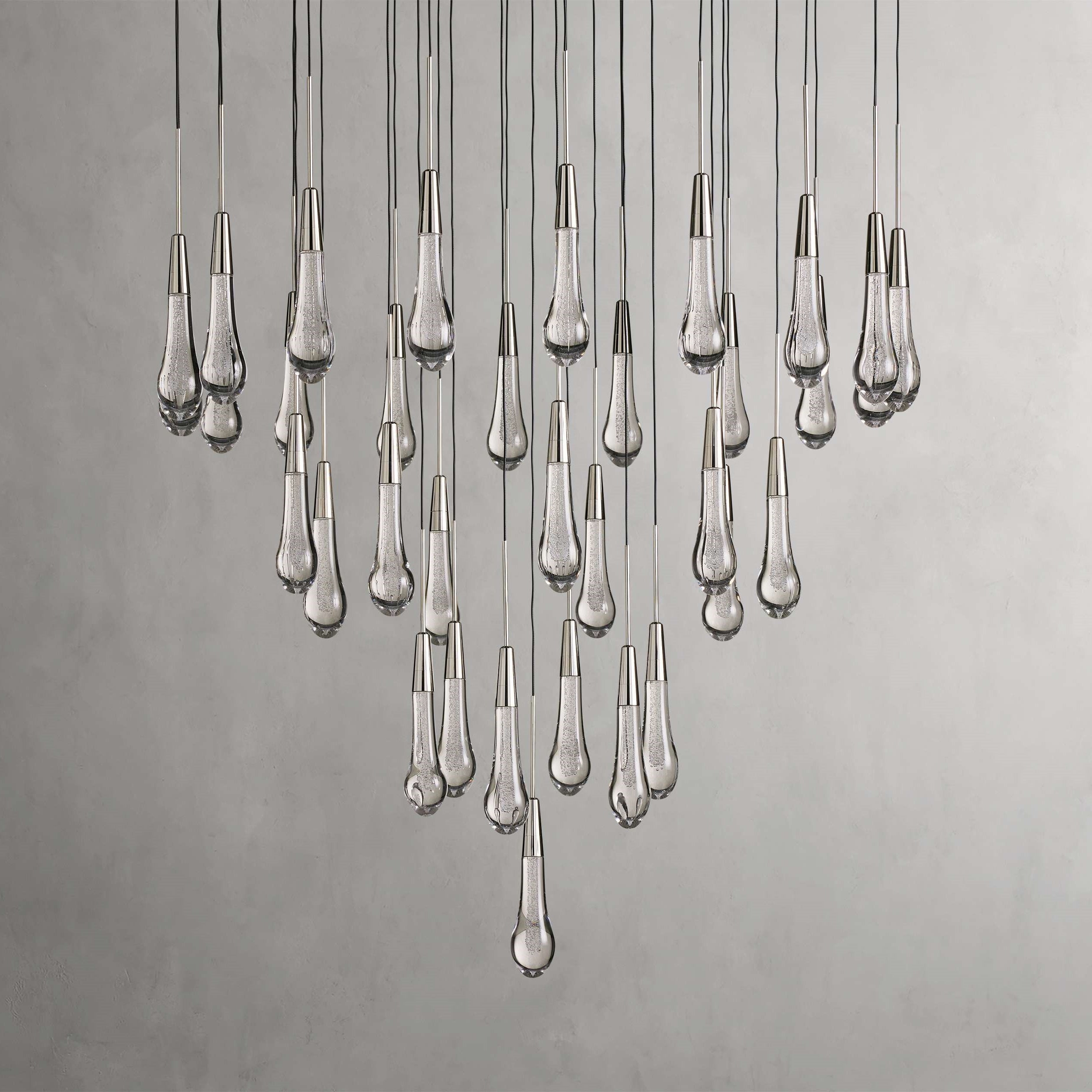 https://cdn.shopify.com/s/files/1/0736/8795/7790/files/solitaire-modern-17-24-36-58-round-chandelier-lighting-merlin-lamps-15.jpg?v=1765374452