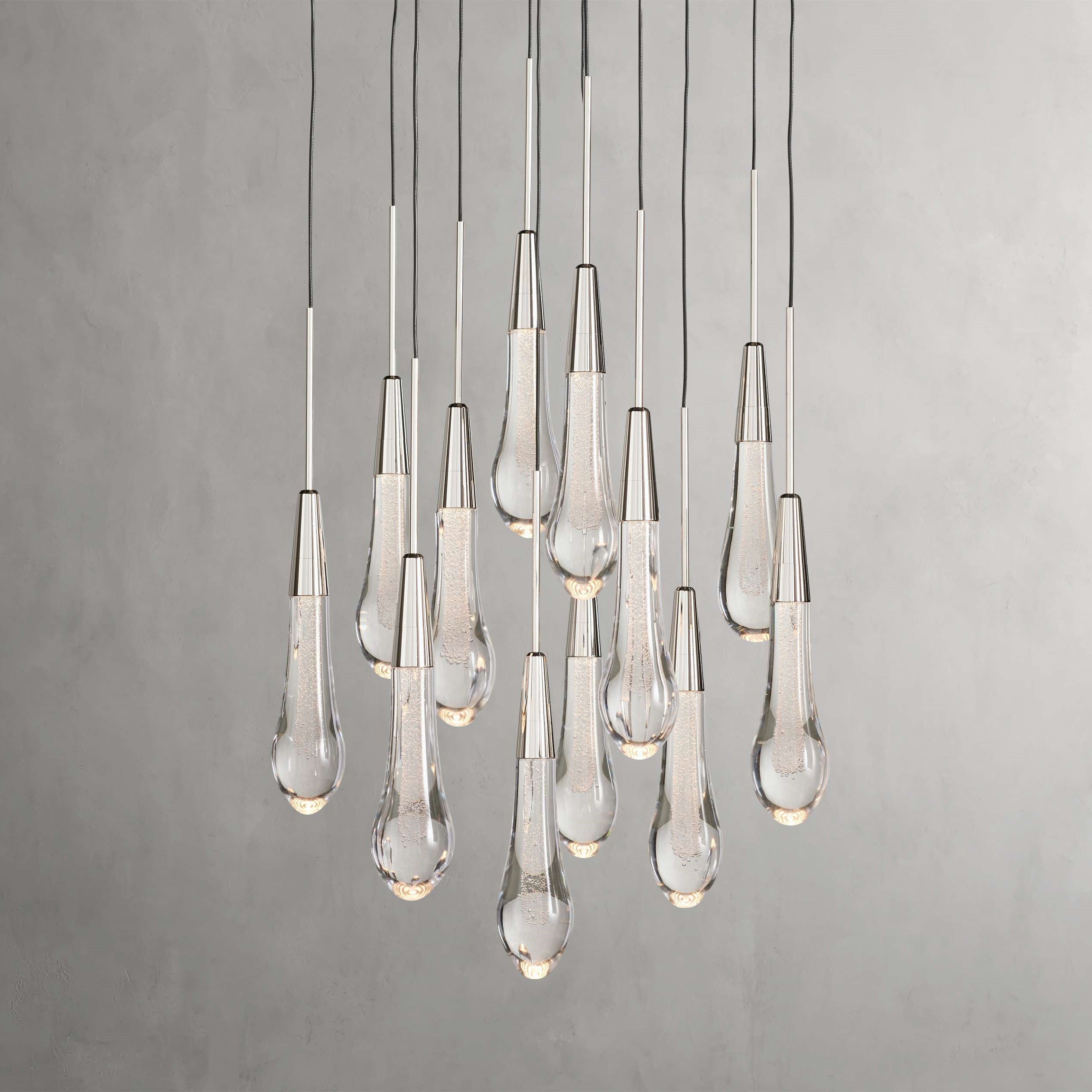 https://cdn.shopify.com/s/files/1/0736/8795/7790/files/solitaire-modern-17-24-36-58-round-chandelier-lighting-merlin-lamps-4.jpg?v=1765374432