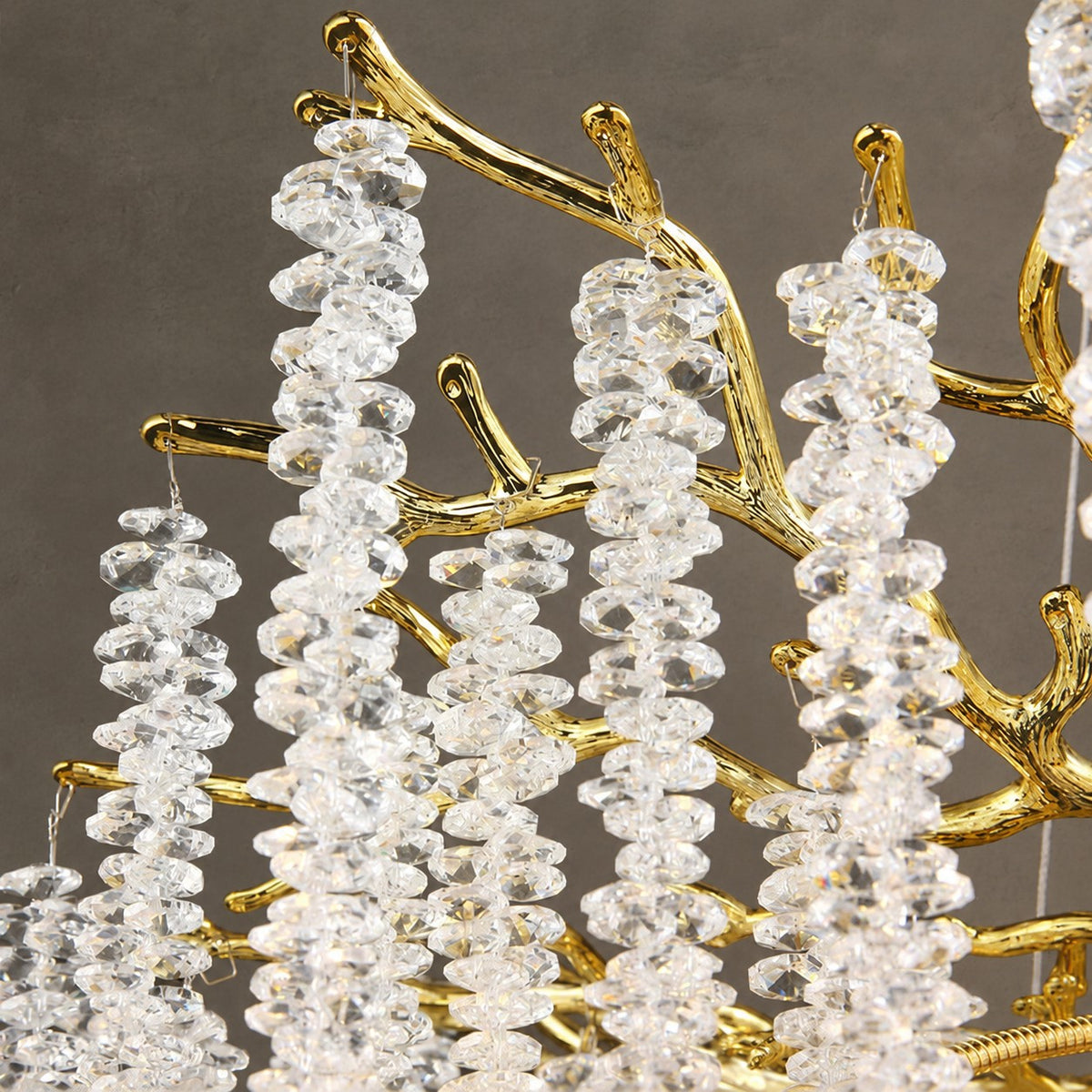 Modern Gold Coin Crystal Linear Branch Chandelier Over Dining Table