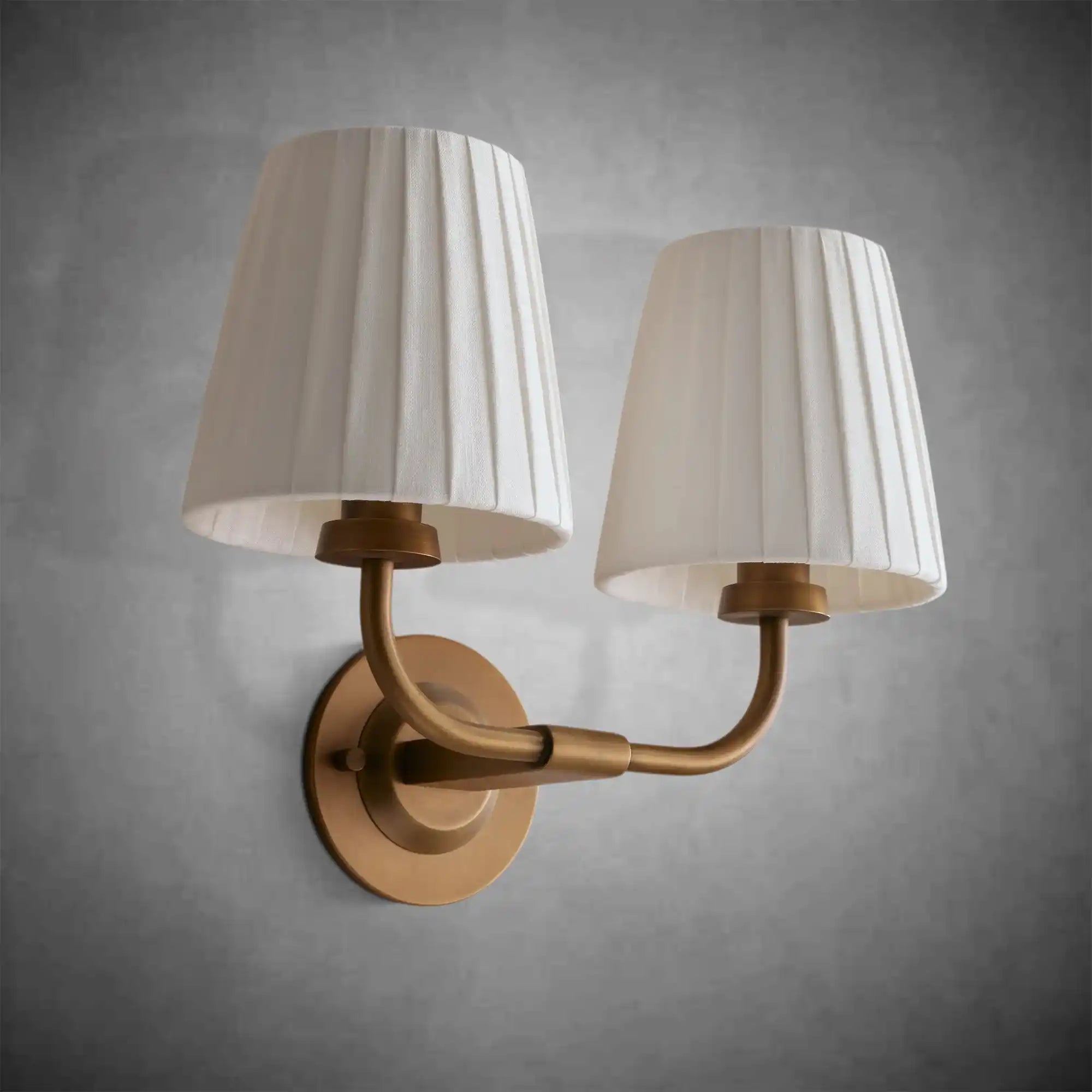 https://cdn.shopify.com/s/files/1/0736/8795/7790/files/adria-double-sconce-pleated-white-4.webp?v=1772615600