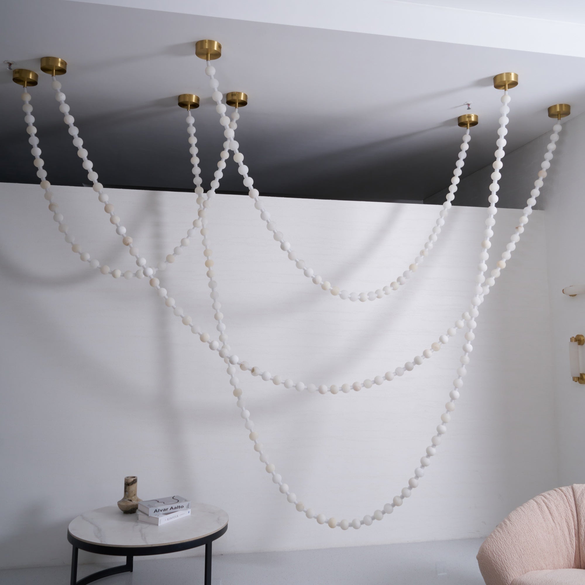https://cdn.shopify.com/s/files/1/0736/8795/7790/files/alabaster-pearl-necklace-chandelier-2126798.jpg?v=1773801534
