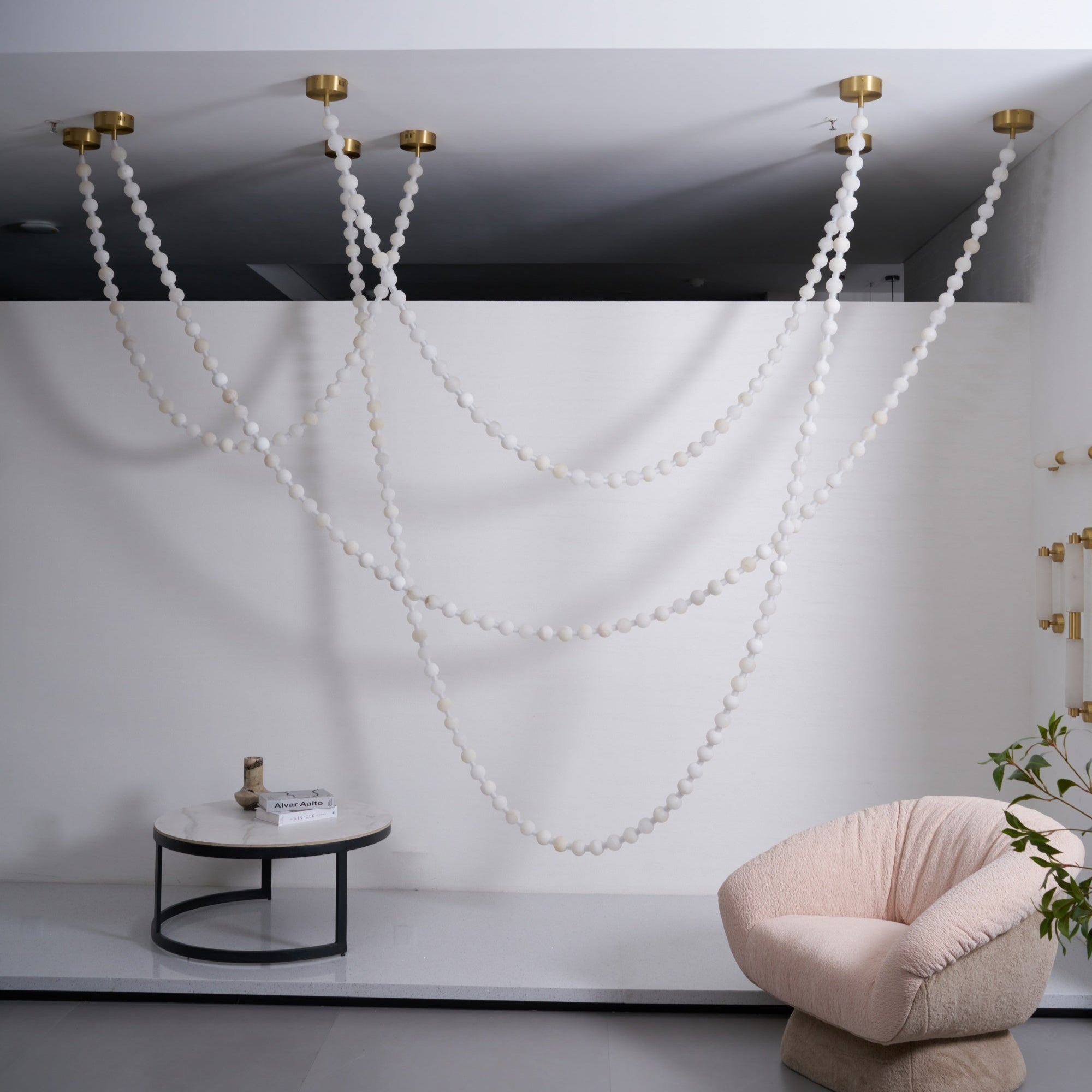 https://cdn.shopify.com/s/files/1/0736/8795/7790/files/alabaster-pearl-necklace-chandelier-2388907.jpg?v=1773801534
