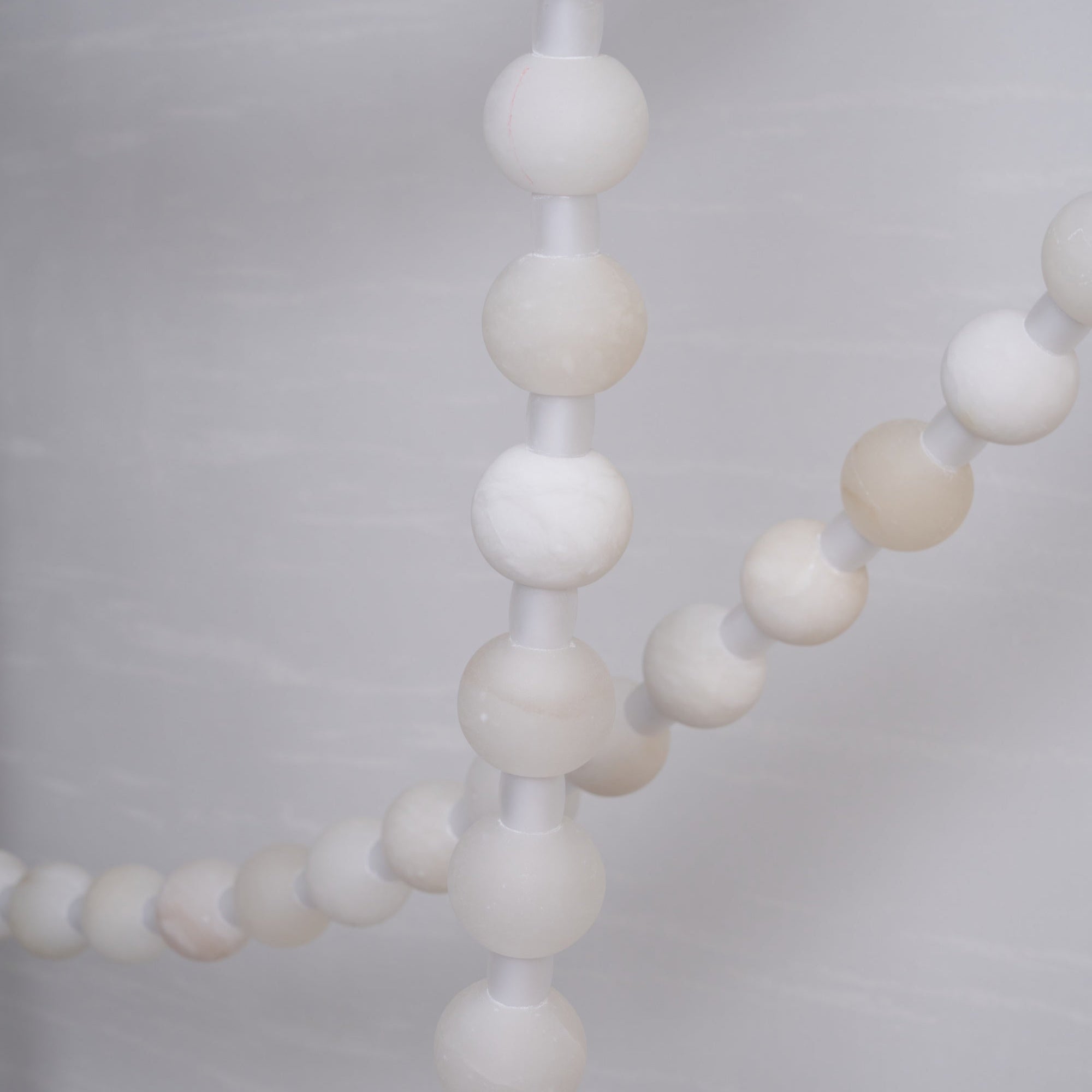 https://cdn.shopify.com/s/files/1/0736/8795/7790/files/alabaster-pearl-necklace-chandelier-3148984.jpg?v=1773801534