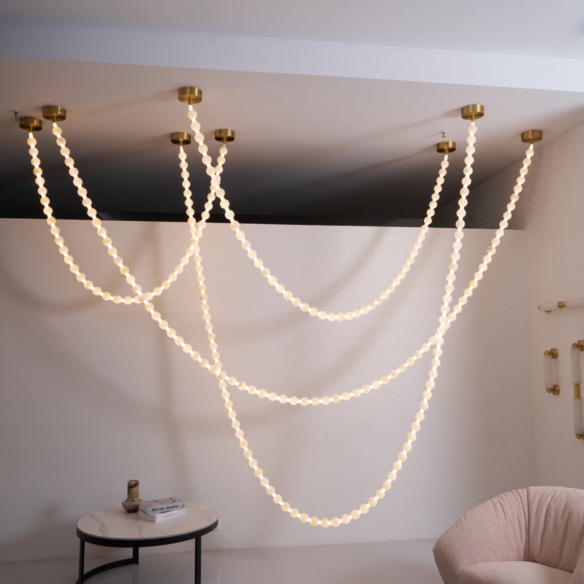 https://cdn.shopify.com/s/files/1/0736/8795/7790/files/alabaster-pearl-necklace-chandelier-6591141.jpg?v=1773801534
