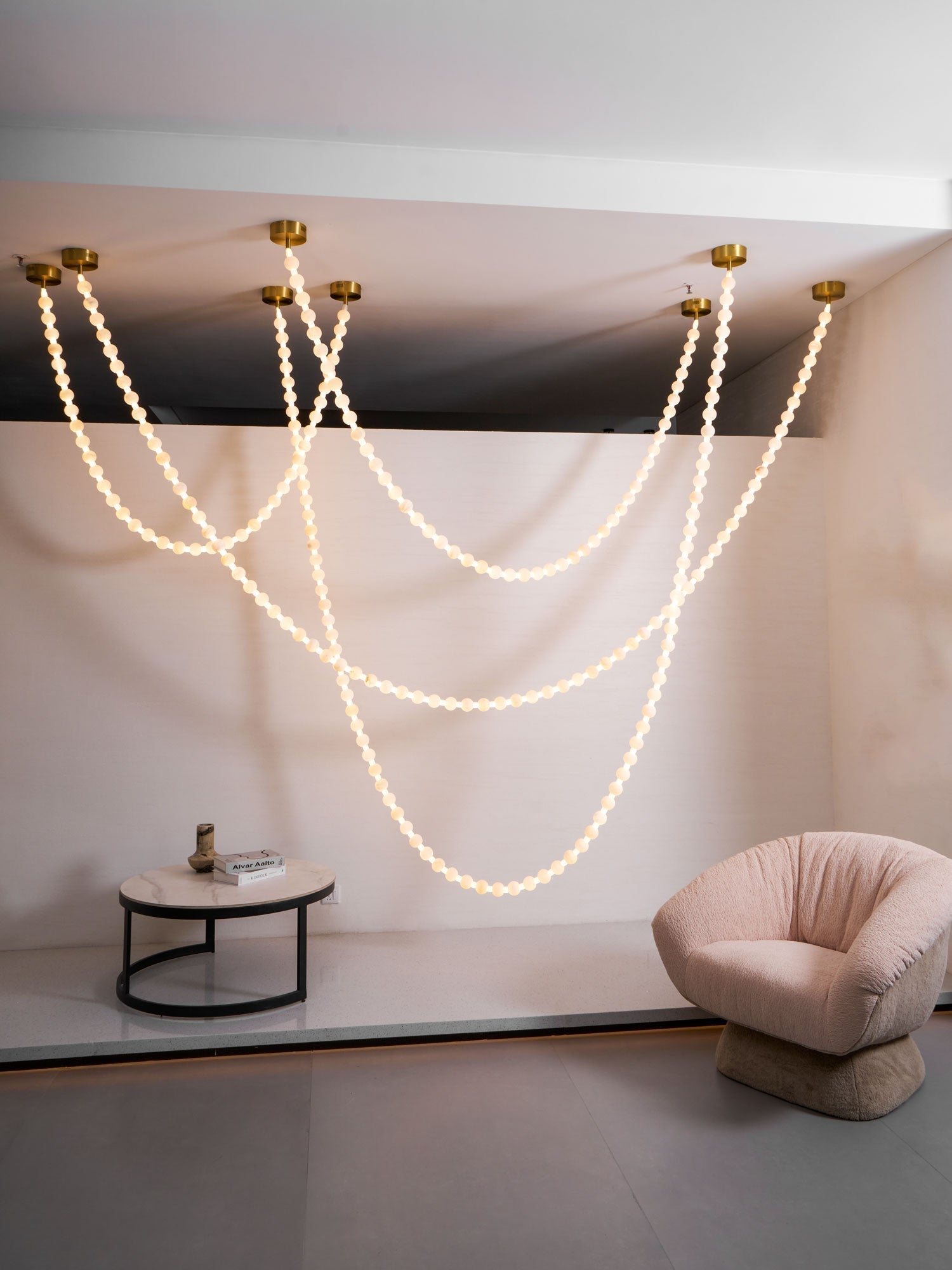 https://cdn.shopify.com/s/files/1/0736/8795/7790/files/alabaster-pearl-necklace-chandelier-7365907.jpg?v=1773801534
