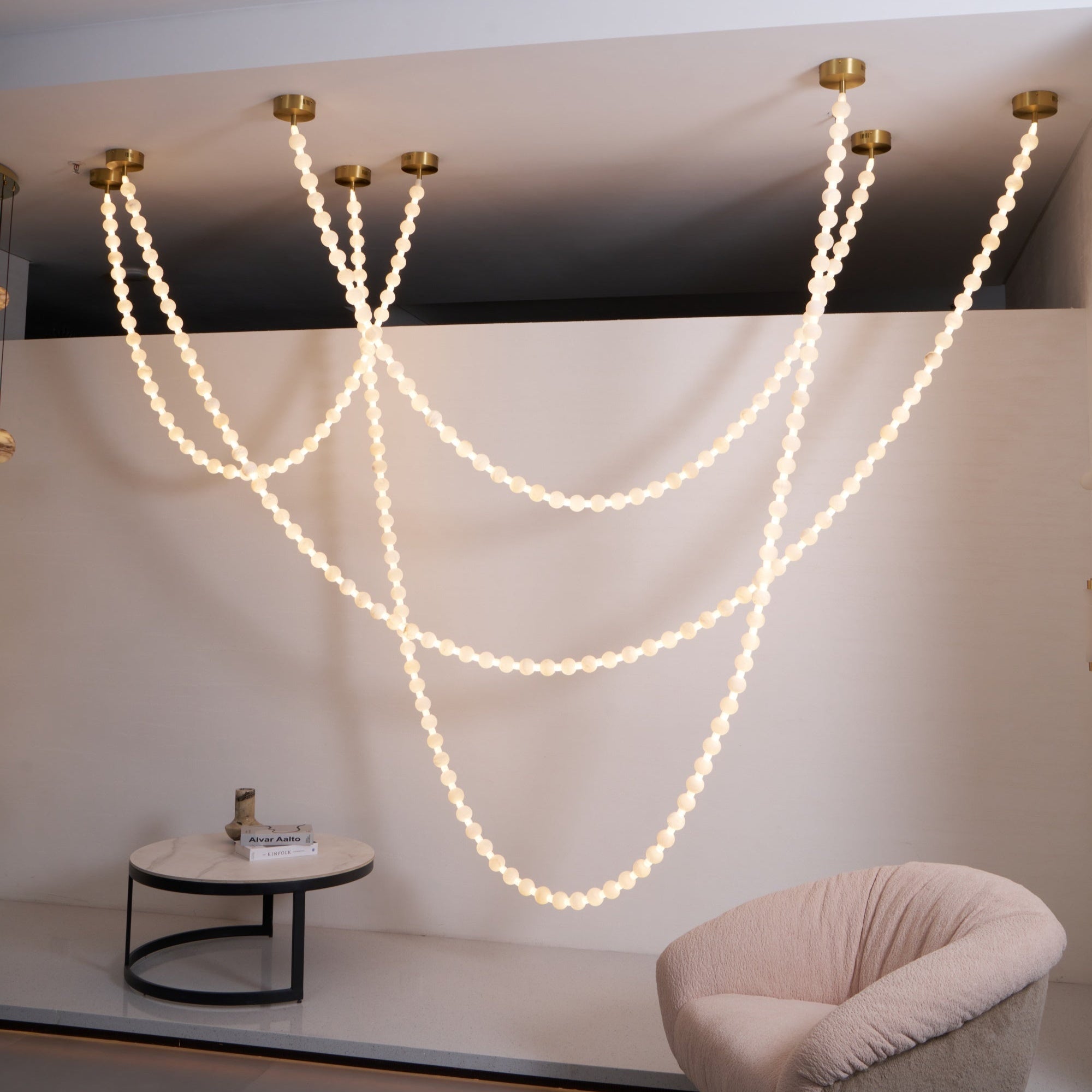 https://cdn.shopify.com/s/files/1/0736/8795/7790/files/alabaster-pearl-necklace-chandelier-7881828.jpg?v=1773801534