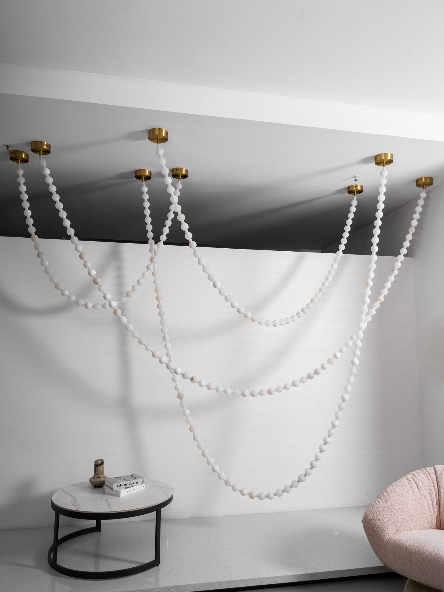 https://cdn.shopify.com/s/files/1/0736/8795/7790/files/alabaster-pearl-necklace-chandelier-9224801.jpg?v=1773801534