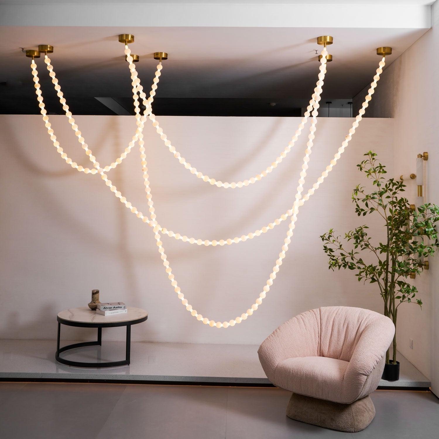 https://cdn.shopify.com/s/files/1/0736/8795/7790/files/alabaster-pearl-necklace-chandelier-9807839.jpg?v=1773801534