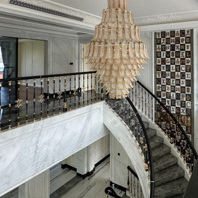 https://cdn.shopify.com/s/files/1/0736/8795/7790/files/extra-large-luxury-multi-tier-gold-crystalchandelier-for-stairslarge-high-ceiling-room-merlin-lamps-3.jpg?v=1765406233