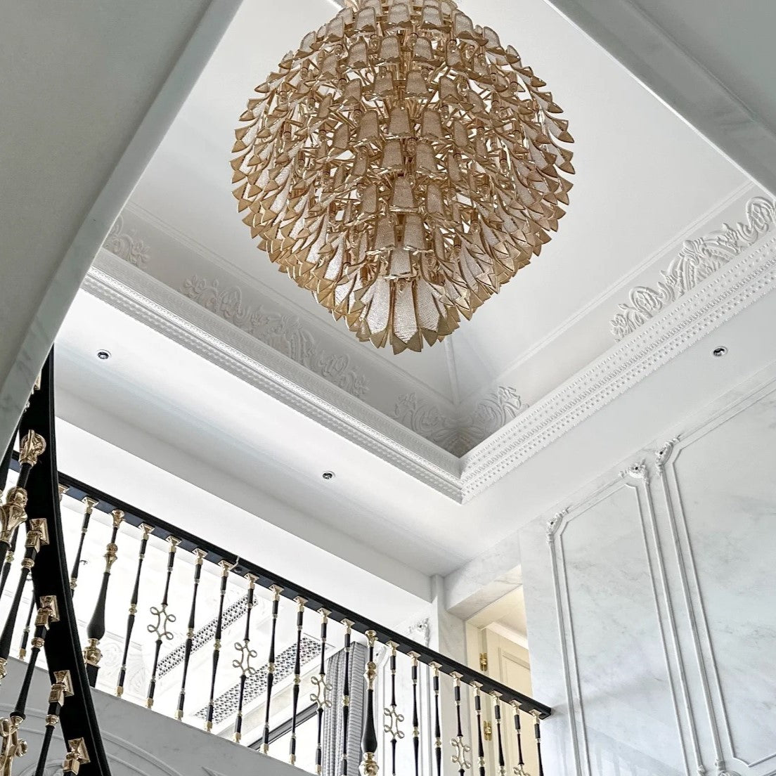 https://cdn.shopify.com/s/files/1/0736/8795/7790/files/extra-large-luxury-multi-tier-gold-crystalchandelier-for-stairslarge-high-ceiling-room-merlin-lamps-4.jpg?v=1765406235