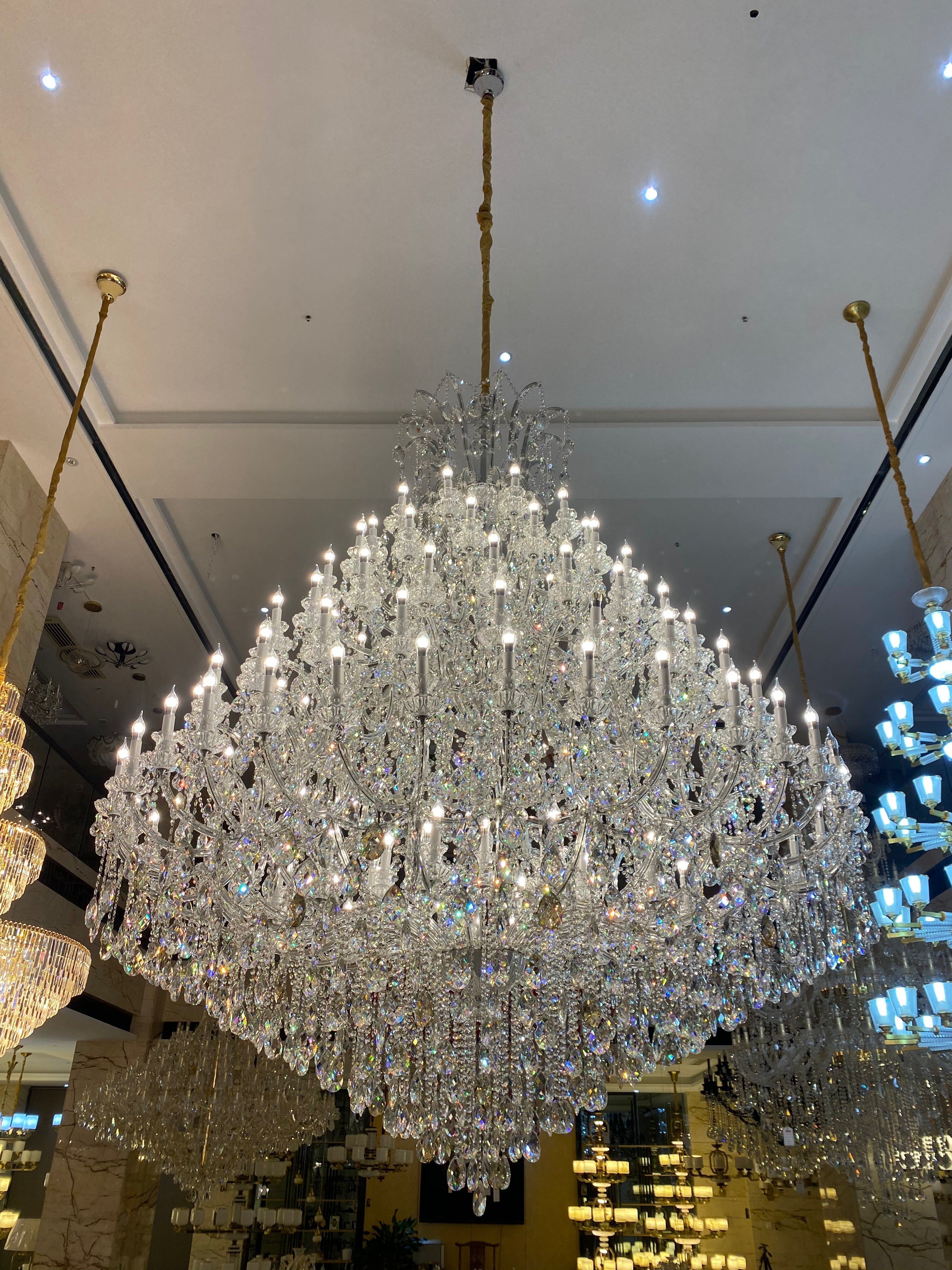 https://cdn.shopify.com/s/files/1/0778/2046/1351/files/extra-large-multi-tiered-candle-light-crystal-chandelier-for-hotelrestaurant-merlin-lamps-9.jpg?v=1765781479