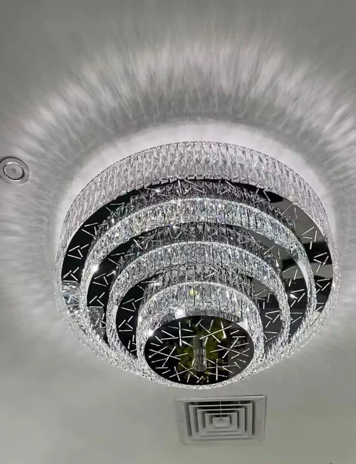 https://cdn.shopify.com/s/files/1/0736/8795/7790/files/oversized-modern-creative-flush-mount-round-multi-layers-crystal-pendant-chandelier-for-livingdining-roomhallway-merlin-lamps-8.webp?v=1765402426