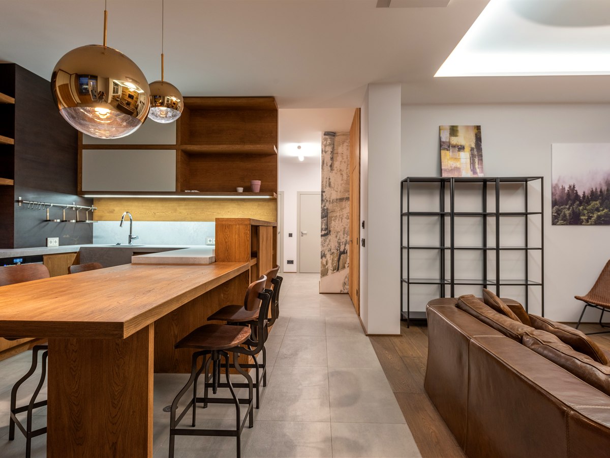 Amber glass globe pendants above a solid oak kitchen island