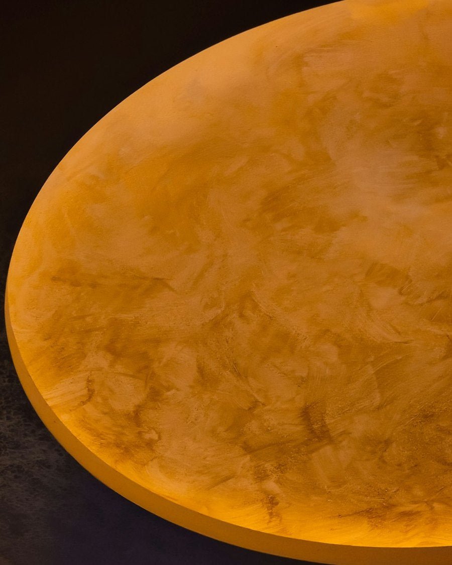 Backlit alabaster shade showing natural stone veining
